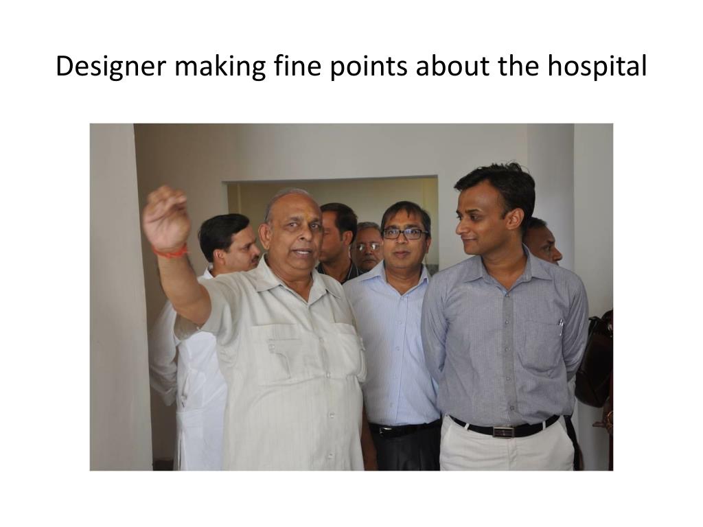 Architect/Designer - Designer making fine points about the hospital